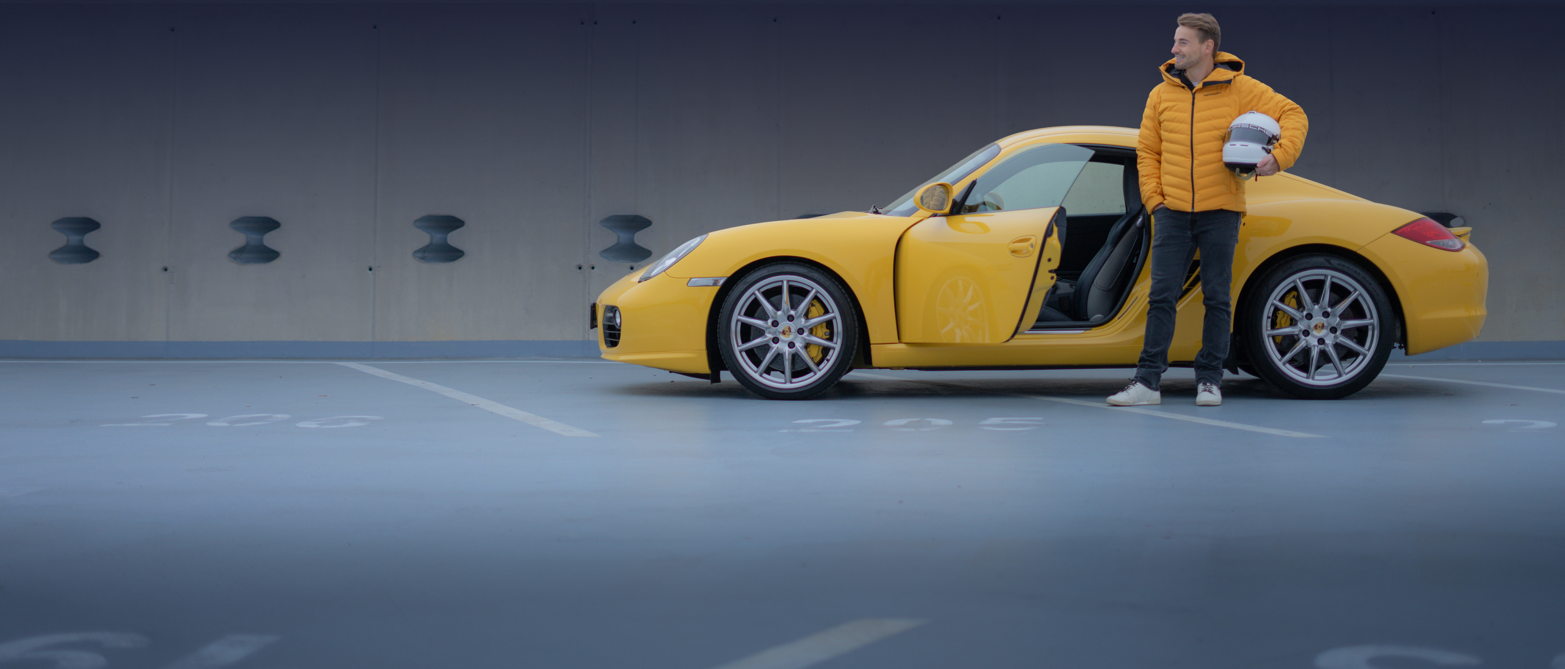Vojtech Hujnak with yellow Porsche Boxster